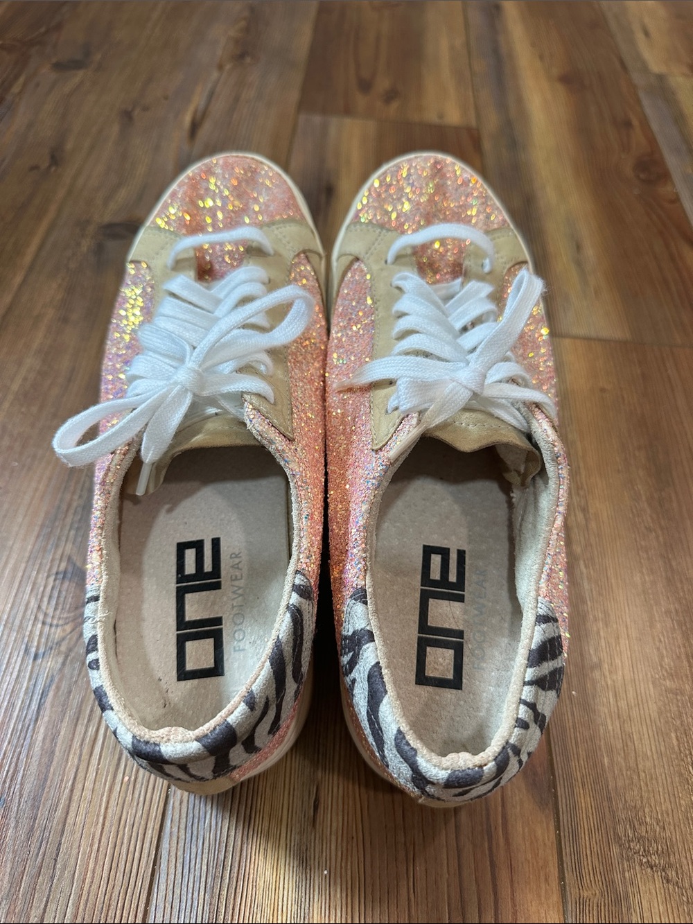 One Footwear pink glitter zebra suede trim sneakers.